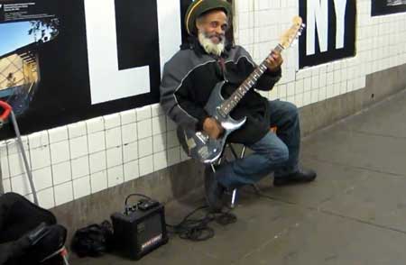 Busker playing electric guitar