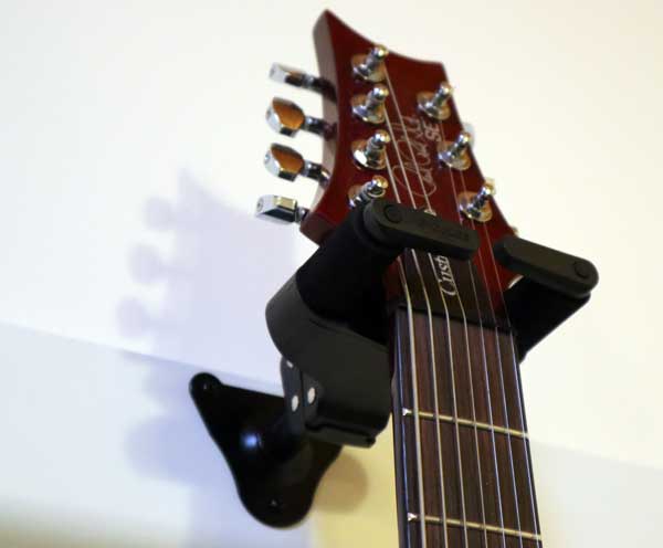 Locking guitar wall hanger